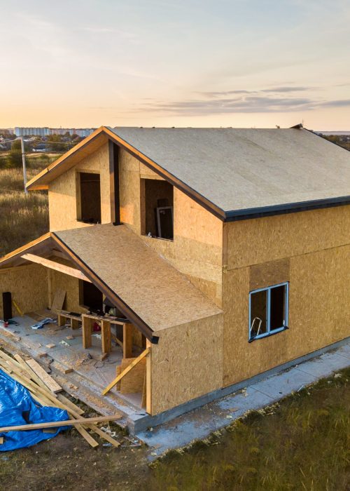 Construction of new and modern modular house. Walls made from composite wooden sip panels with styrofoam insulation inside. Building new frame of energy efficient home concept.